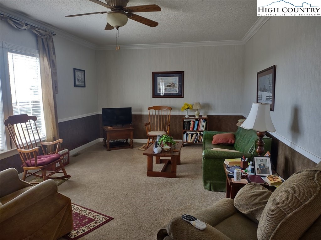 1407 Barrett Road Ennice, NC 28623 - Photo 13 of 24 a living room with furniture and a flat screen tv