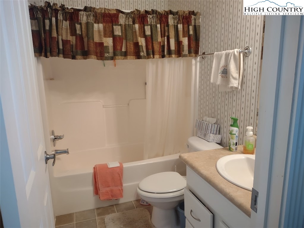 1407 Barrett Road Ennice, NC 28623 - Photo 22 of 24 a bathroom with a sink and toilet