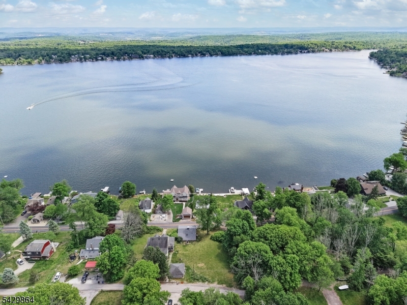 77 Lower North Shore Road Branchville, NJ 07826 - Photo 37 of 38 a view of a lake with a field