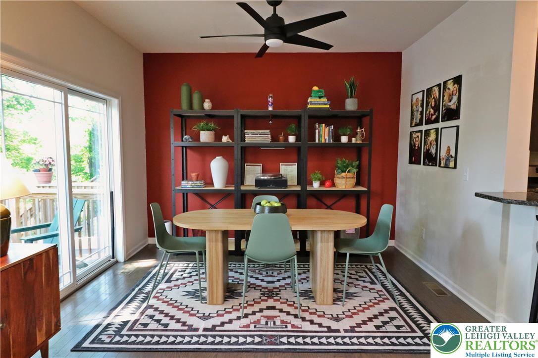 4502 Benjamin Court Emmaus, PA 18049 - Photo 15 of 53 Hardwood floors complement a cozy dining area with convenient outdoor access.