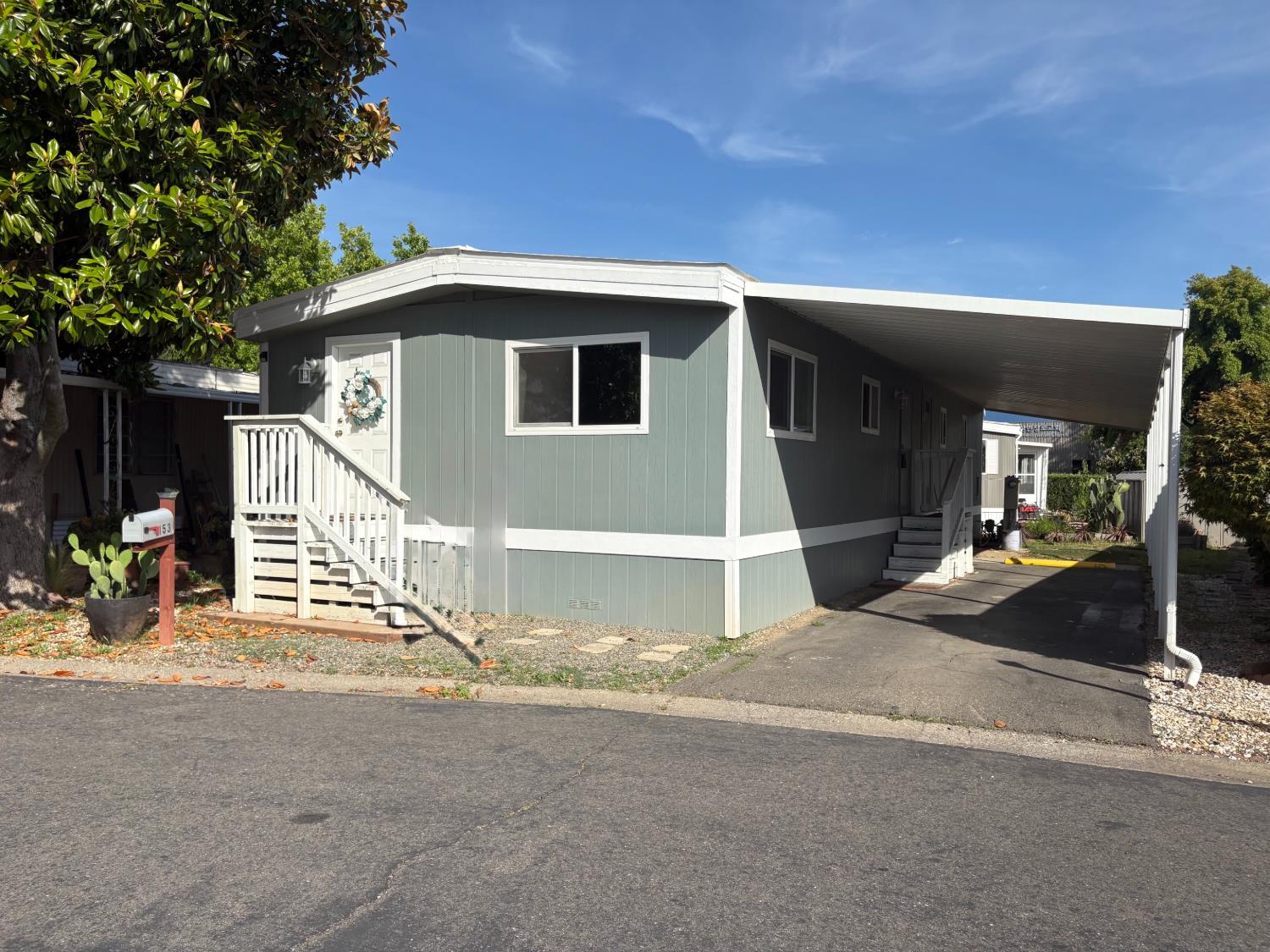 10035 Mills Station Road, Unit 153 Sacramento, CA 95827 - Photo 24 of 24 a view of a house with a patio