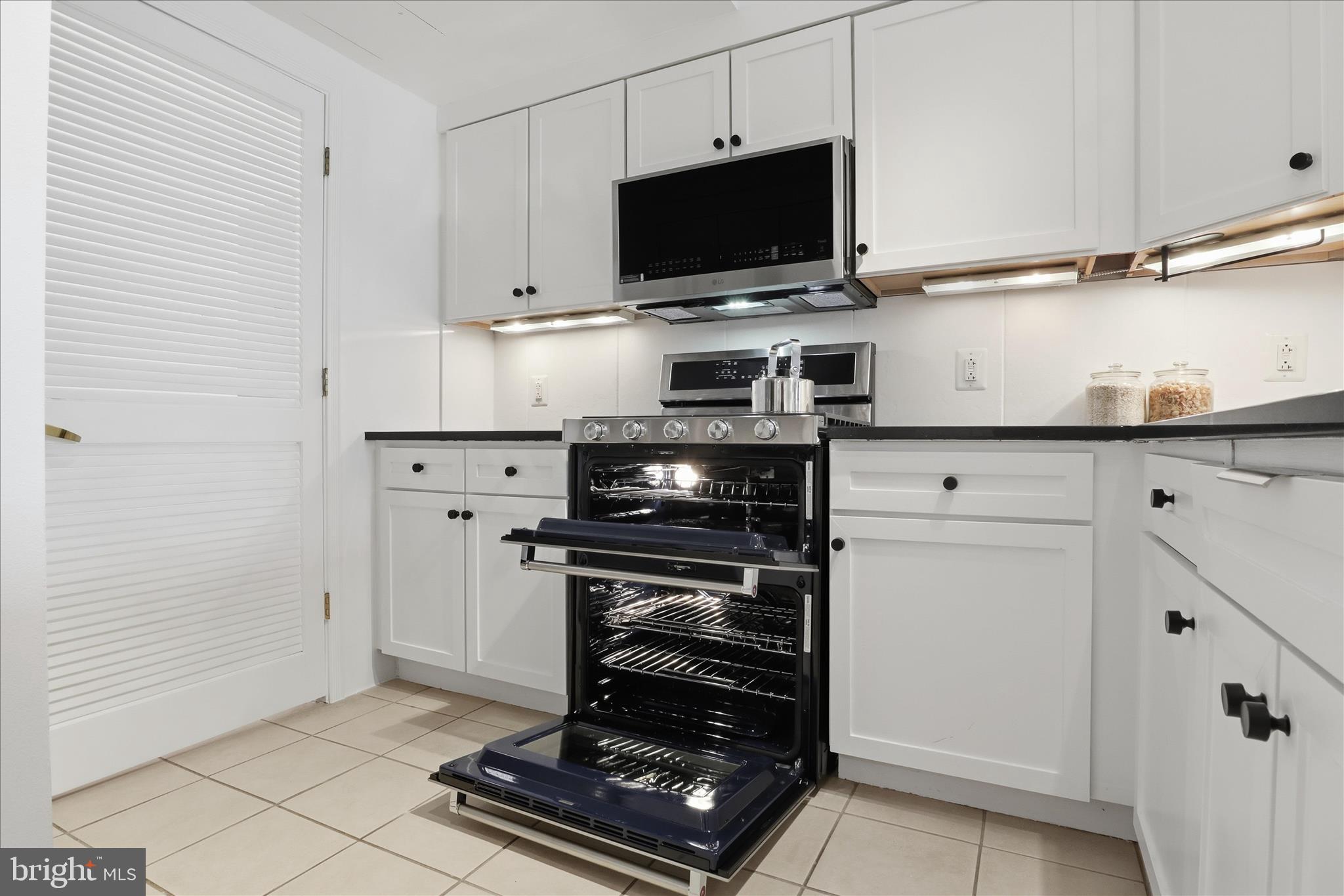 631 D Street Northwest, Unit 1227 Washington, DC 20004 - Photo 13 of 63 a kitchen with cabinets and appliances