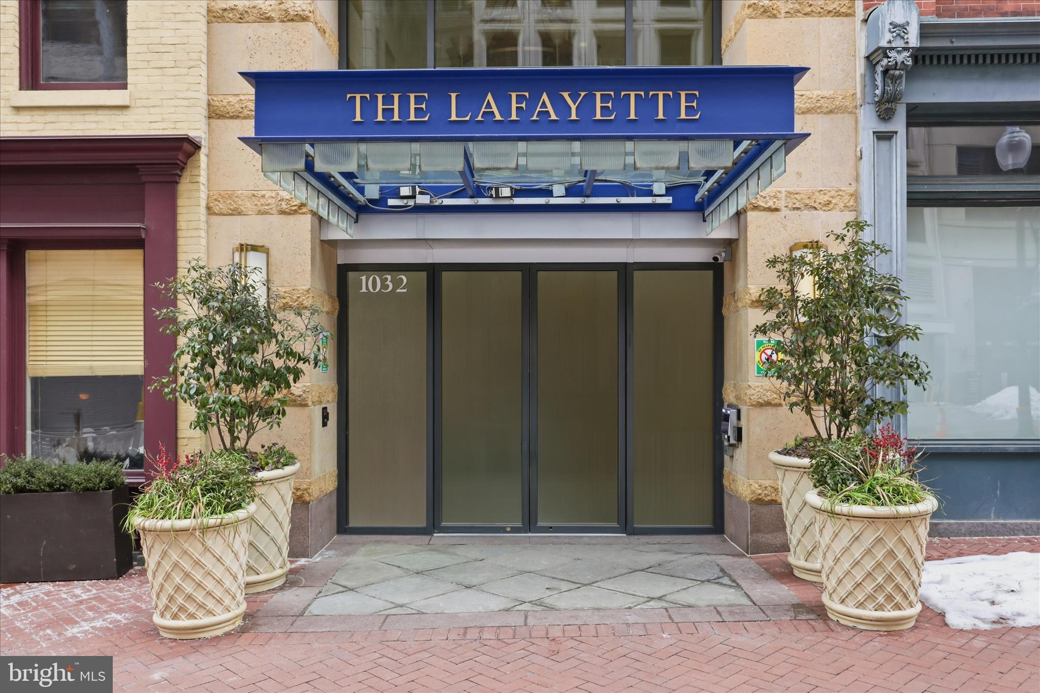 631 D Street Northwest, Unit 1227 Washington, DC 20004 - Photo 23 of 63 a building with potted plants in front of it