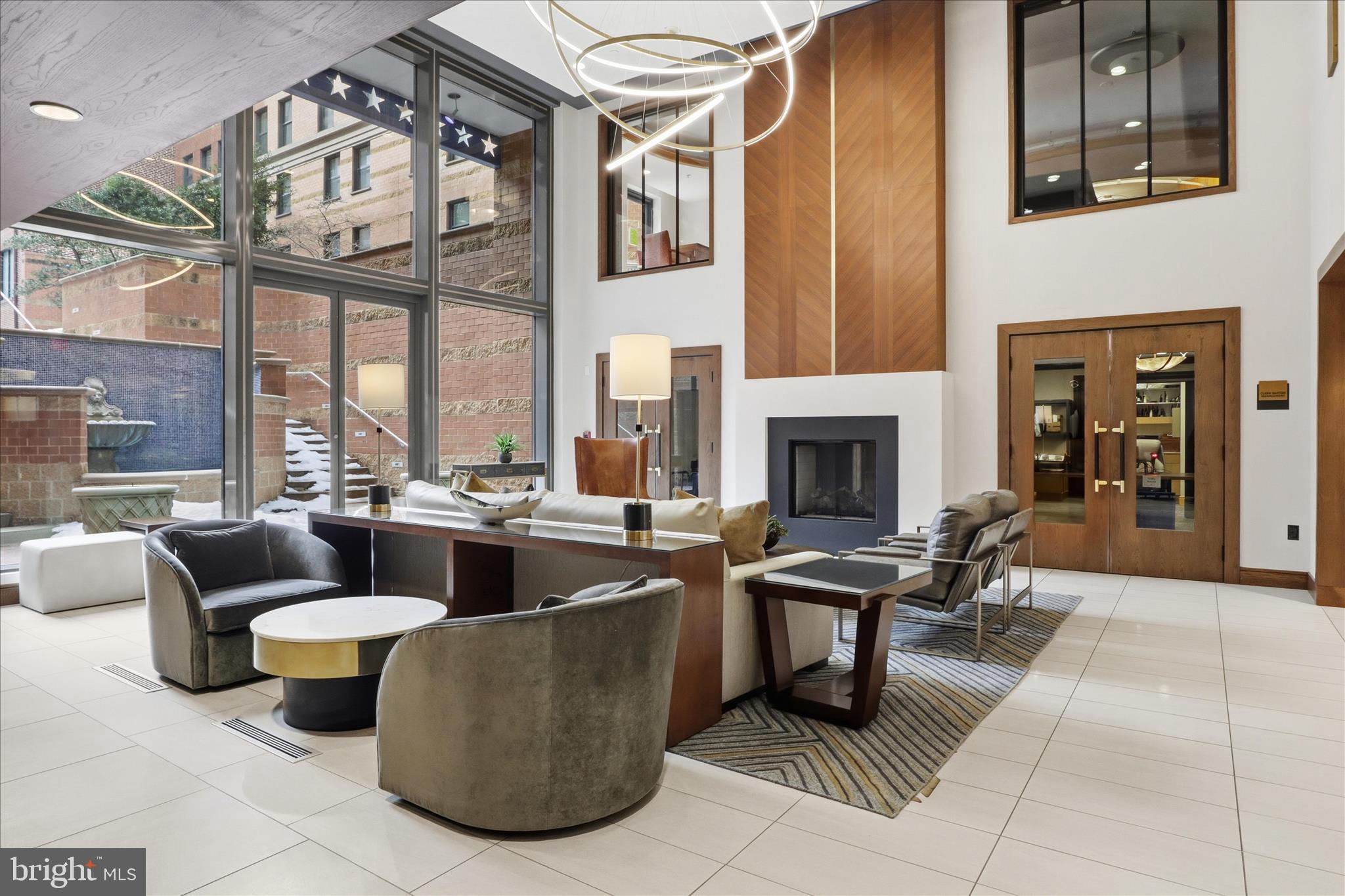 631 D Street Northwest, Unit 1227 Washington, DC 20004 - Photo 32 of 63 a living room with fireplace furniture and a large window