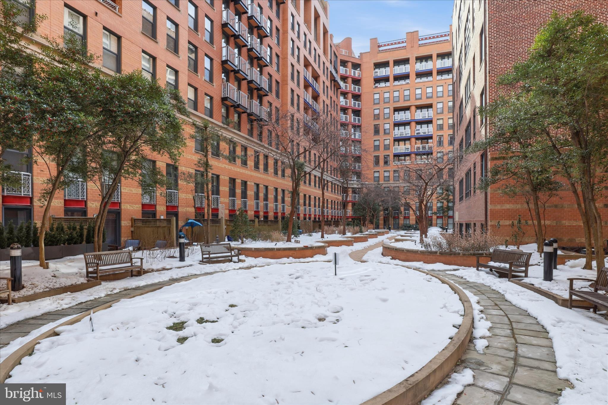 631 D Street Northwest, Unit 1227 Washington, DC 20004 - Photo 55 of 63 a view of a building with snow on the road