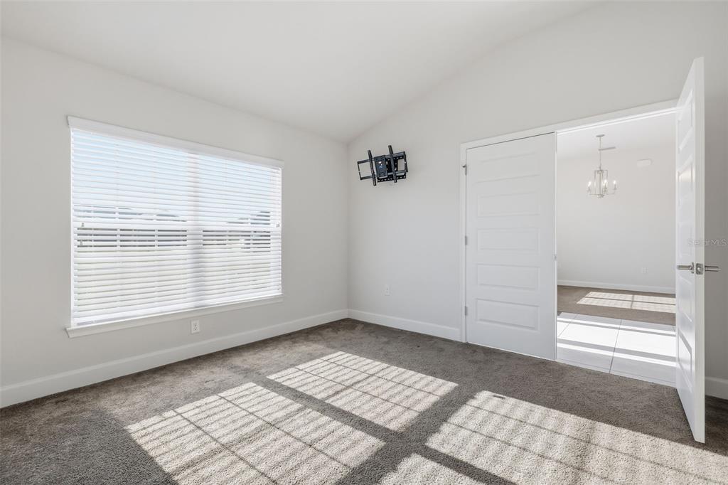 9144 Southeast 47th Court Road Ocala, FL 34480 - Photo 14 of 32 a view of an empty room with a window
