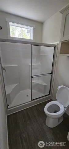 a bathroom with a sink a toilet and vanity