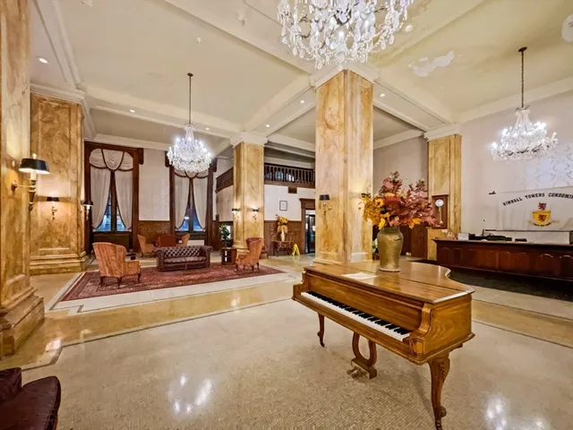 a living room with patio pool table and chairs