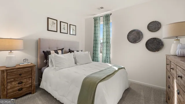 a bedroom with a bed and cabinets