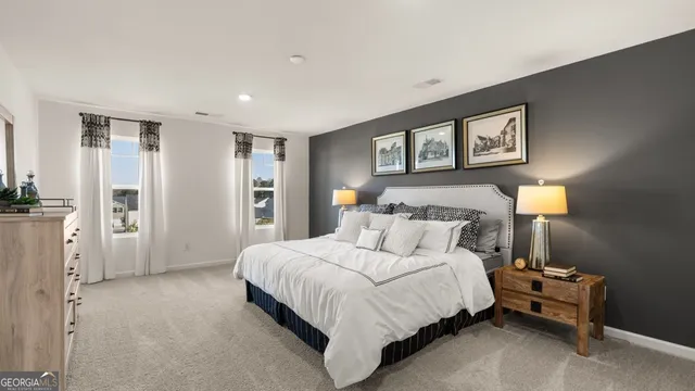 a bedroom with a bed and a night stand