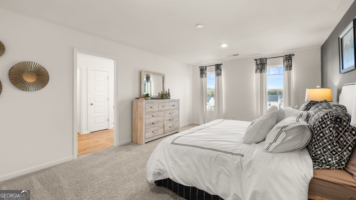 190 Aster Avenue Locust Grove, GA 30248 - Photo 37 of 45 a bedroom with a bed and cabinets