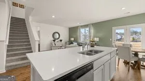 a kitchen with a sink and a refrigerator