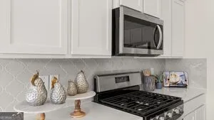 a kitchen with a stove and cabinets