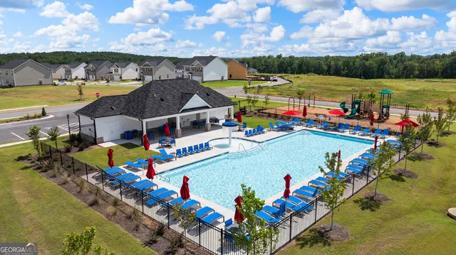 an aerial view of a yard and swimming pool