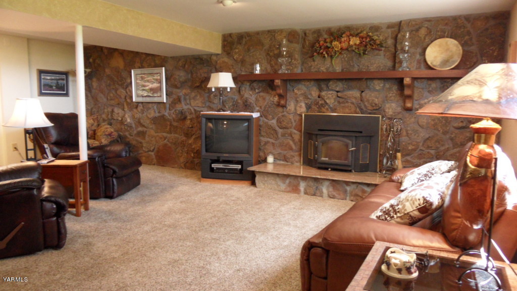 211 East Duffield Road Moxee, WA 98936 - Photo 18 of 34 a living room with furniture and a fireplace