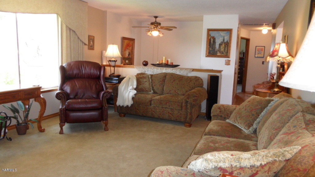 211 East Duffield Road Moxee, WA 98936 - Photo 9 of 34 a living room with furniture and a fireplace