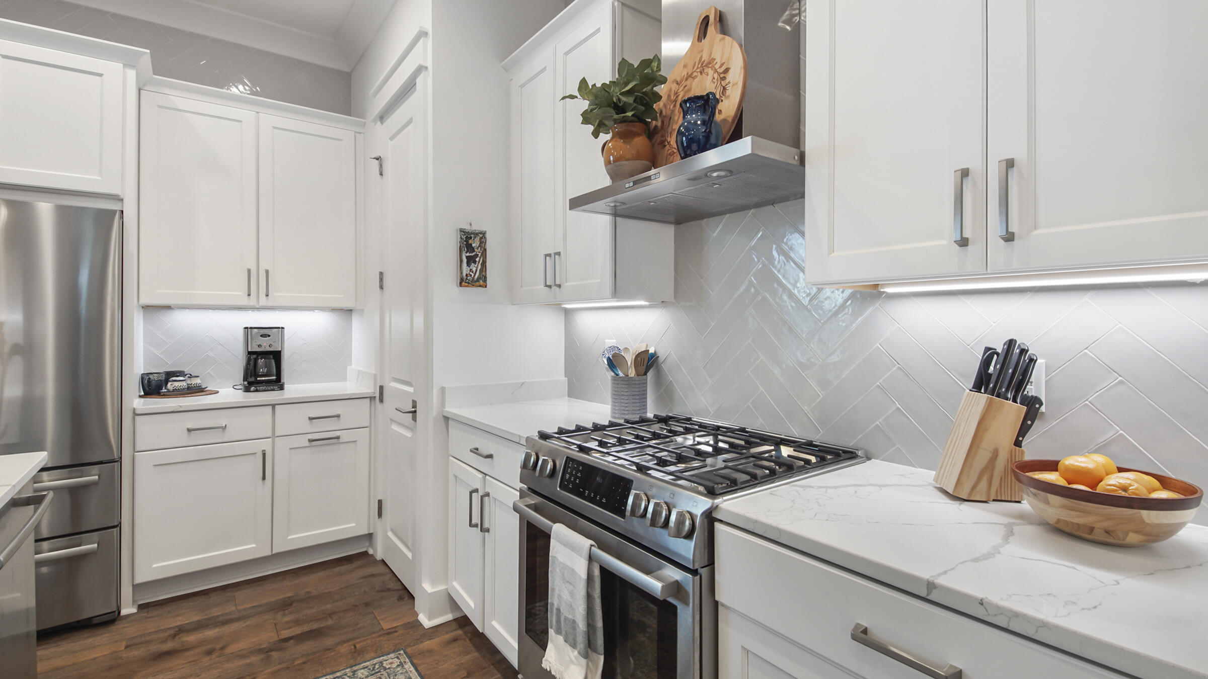 111 Firefly Way Watersound, FL 32461 - Photo 12 of 54 a kitchen with a stove and cabinets