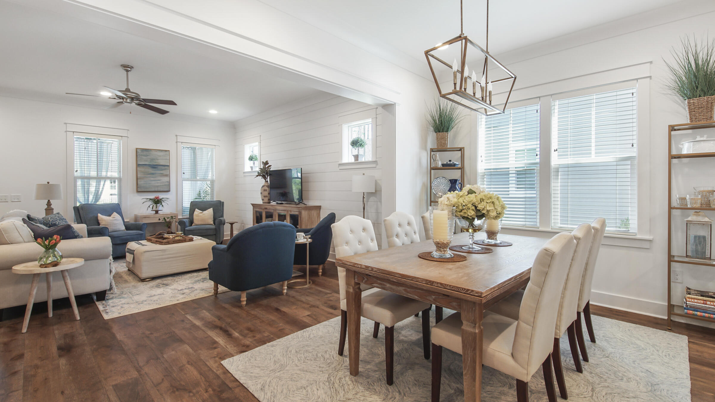 111 Firefly Way Watersound, FL 32461 - Photo 15 of 54 a view of a dining room with furniture window and wooden floor