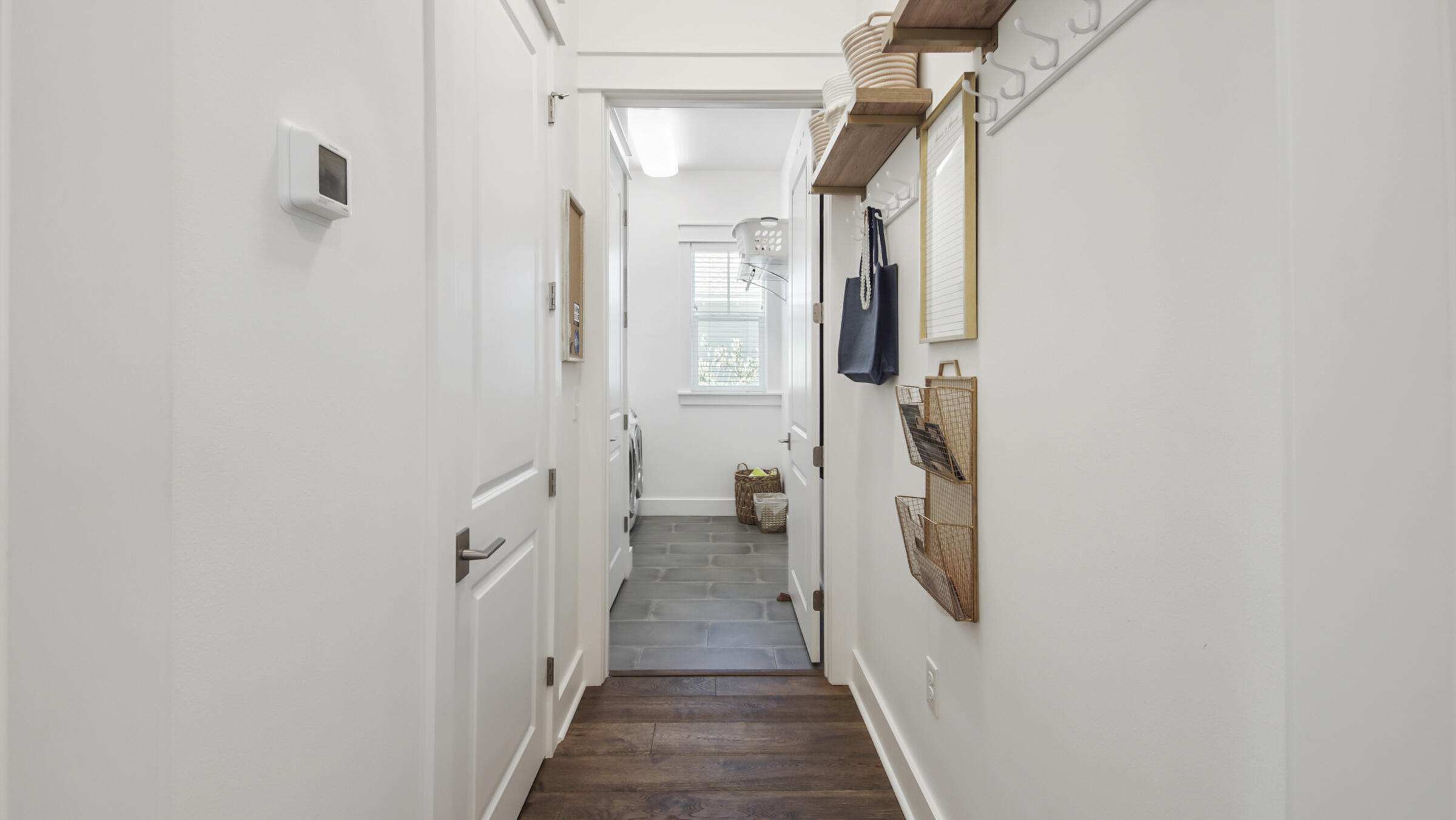 111 Firefly Way Watersound, FL 32461 - Photo 16 of 54 a view of a hallway with wooden floor and closet