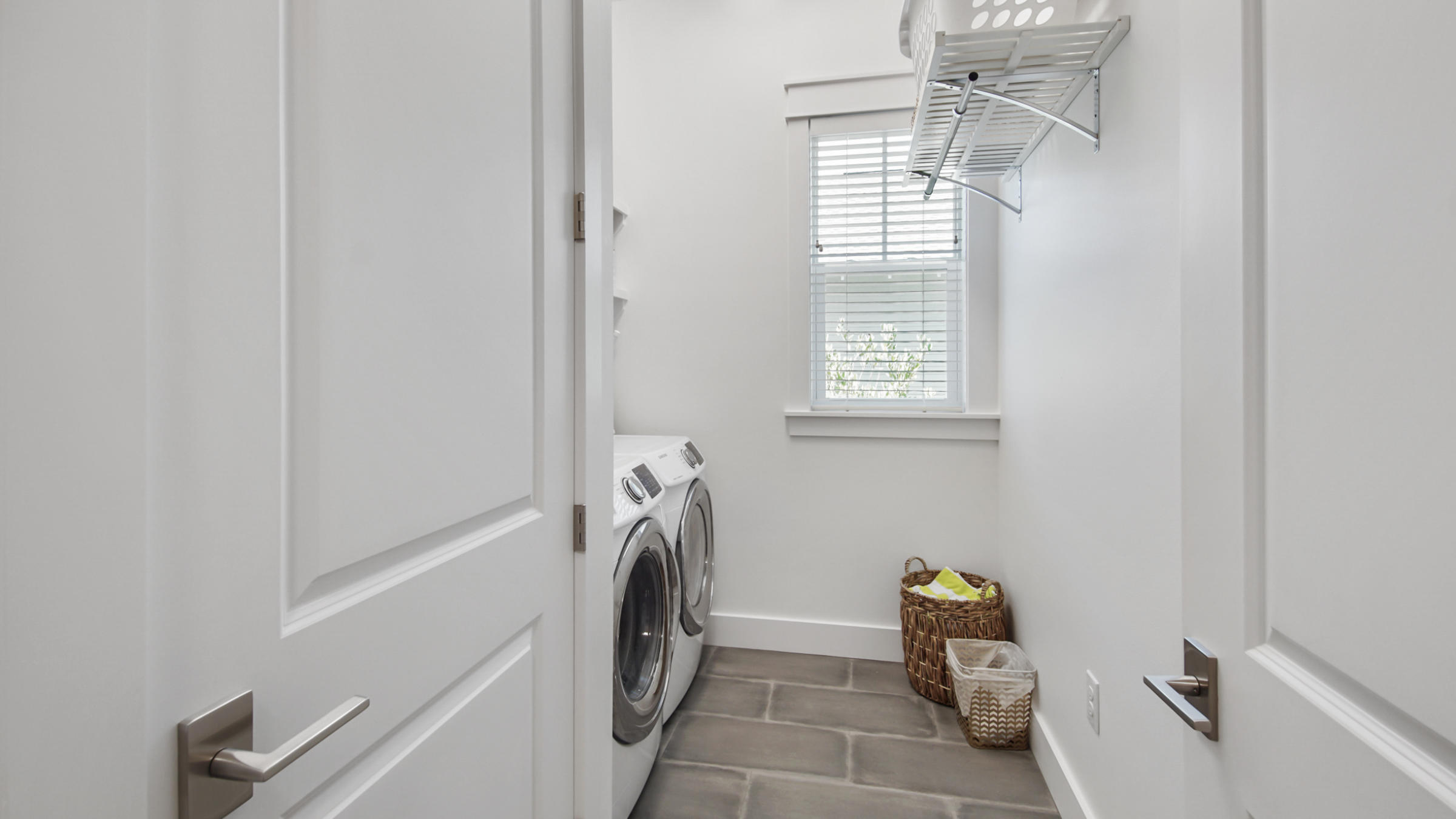 111 Firefly Way Watersound, FL 32461 - Photo 17 of 54 a view of storage and utility room with washer and dryer