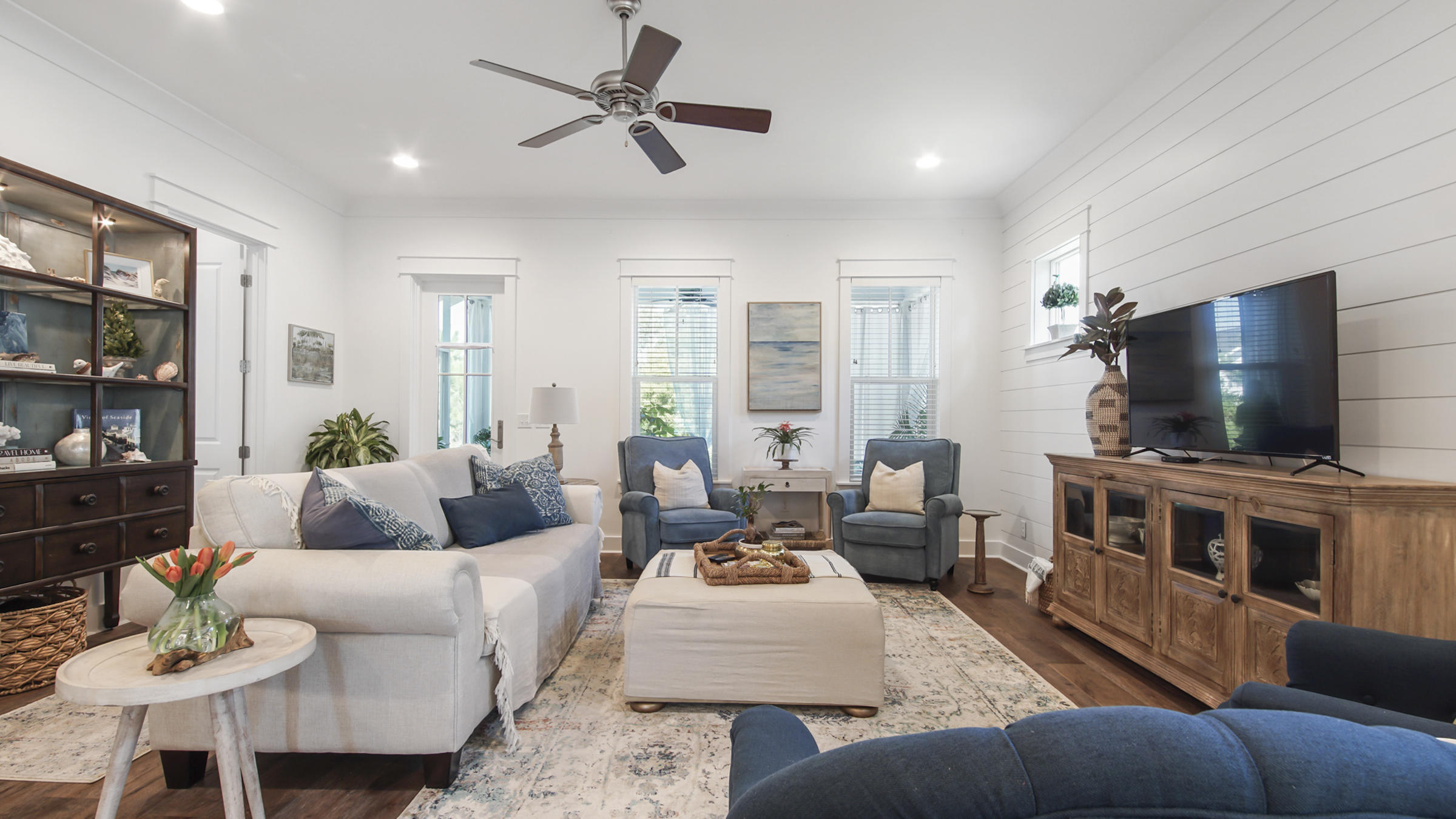 111 Firefly Way Watersound, FL 32461 - Photo 18 of 54 a living room with furniture and a flat screen tv