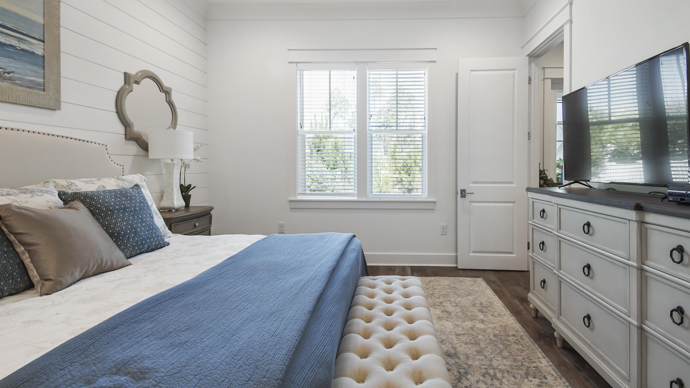 111 Firefly Way Watersound, FL 32461 - Photo 22 of 54 a bedroom with furniture and windows