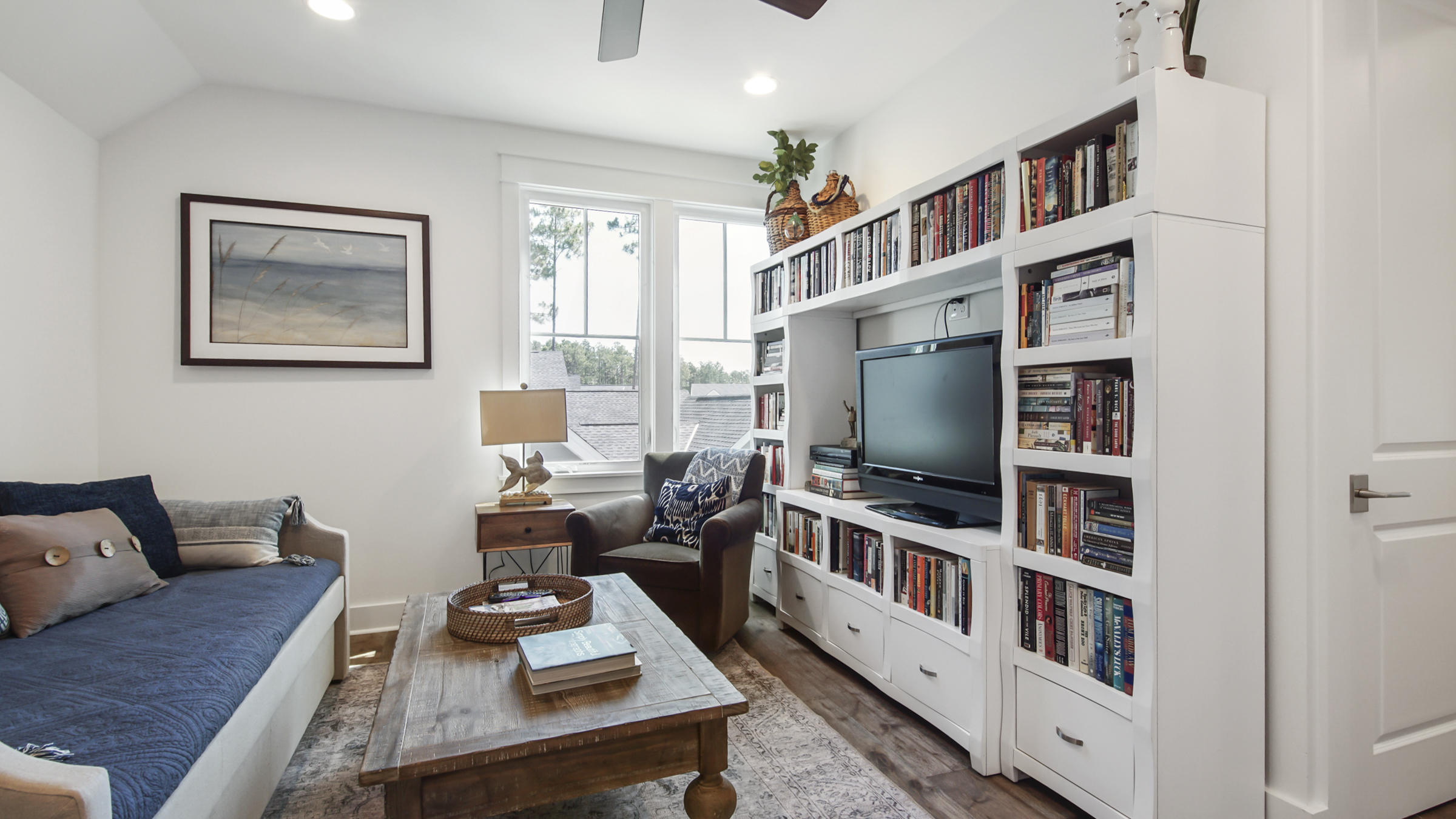 111 Firefly Way Watersound, FL 32461 - Photo 29 of 54 a living room with furniture and a flat screen tv