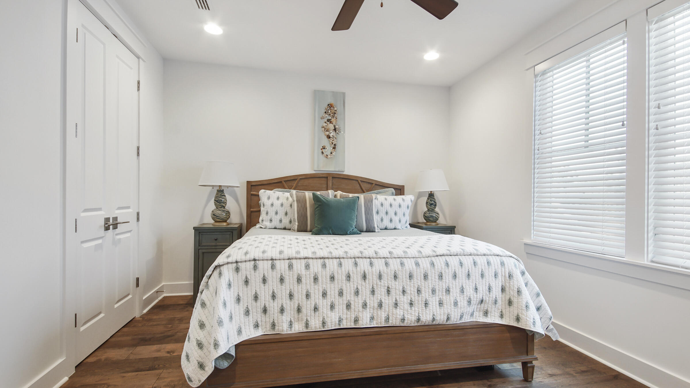 111 Firefly Way Watersound, FL 32461 - Photo 31 of 54 a bedroom with a bed and window