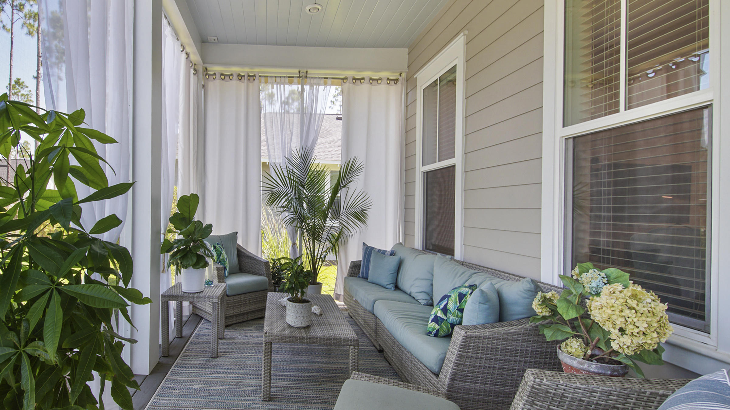 111 Firefly Way Watersound, FL 32461 - Photo 36 of 54 a view of a patio with couches and a potted plant