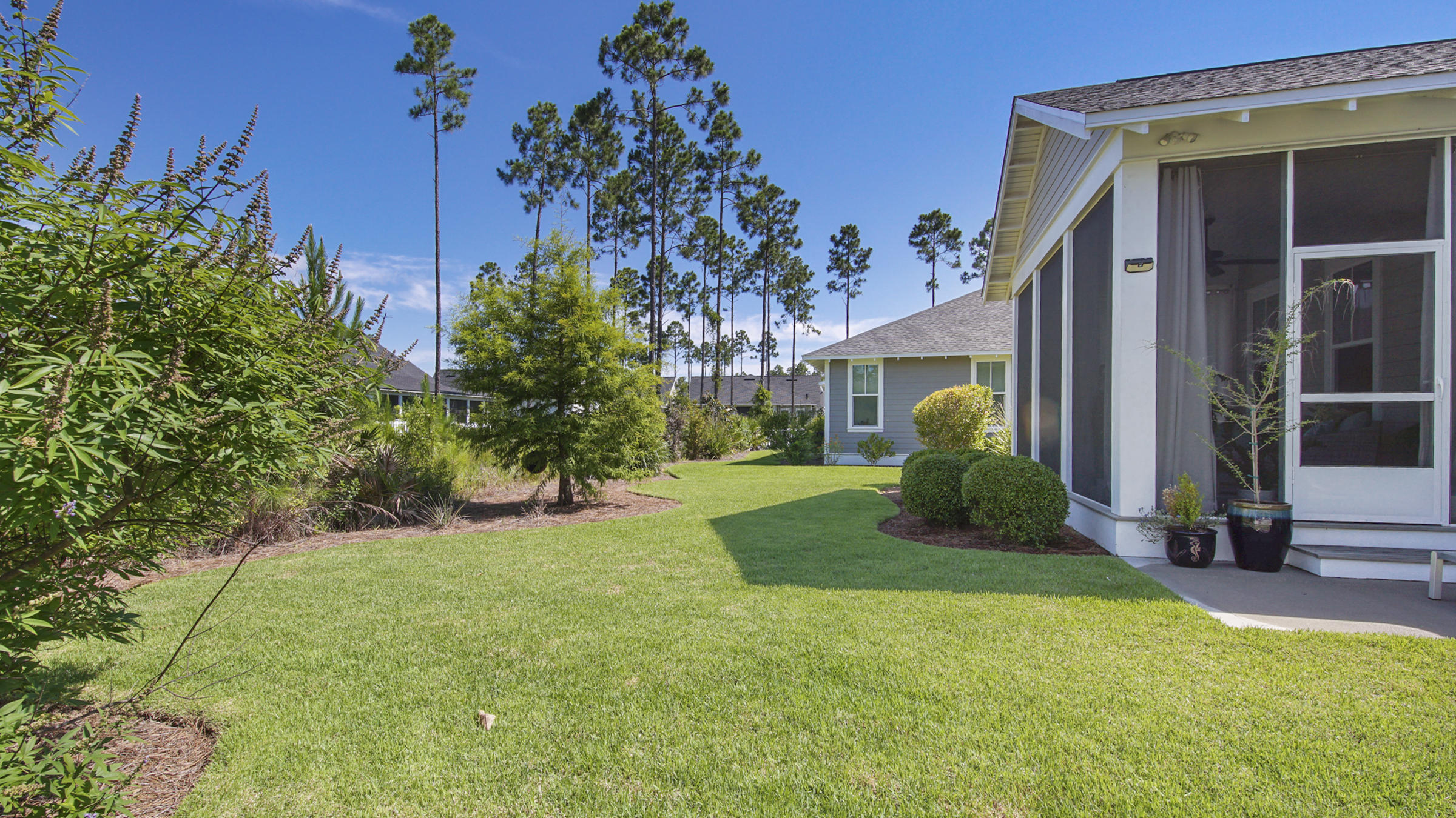 111 Firefly Way Watersound, FL 32461 - Photo 38 of 54 a view of a house with a yard
