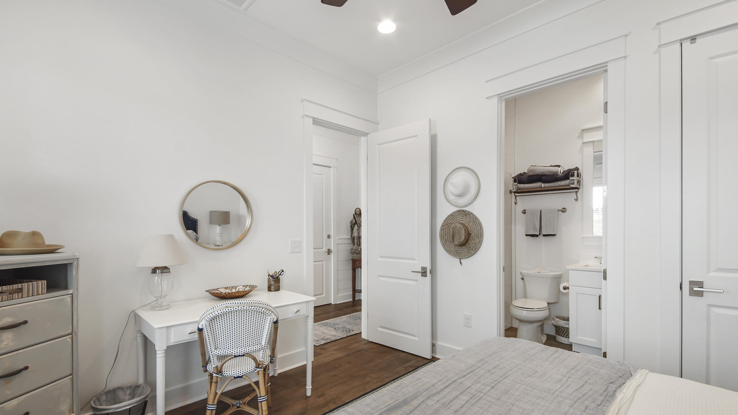 111 Firefly Way Watersound, FL 32461 - Photo 7 of 54 a living room with furniture a clock and white walls