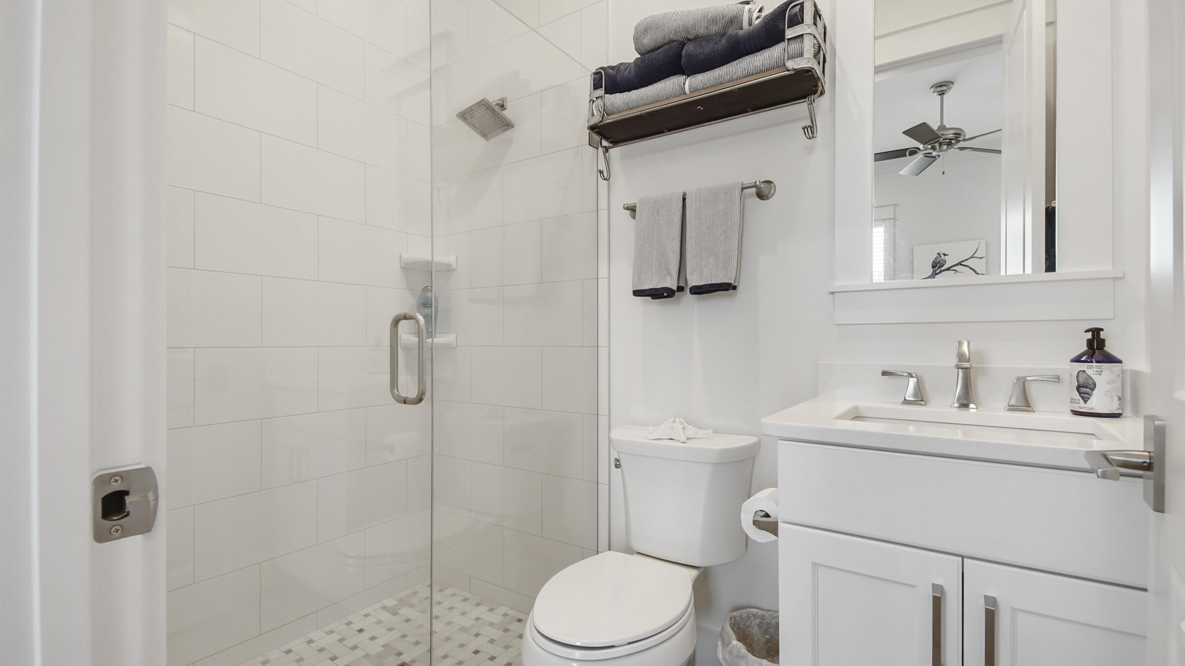 111 Firefly Way Watersound, FL 32461 - Photo 8 of 54 a bathroom with a sink toilet and shower