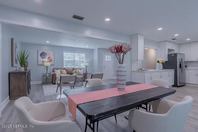 a bed room with a bed window and mirror