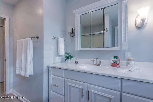 a house with swimming pool in front of it