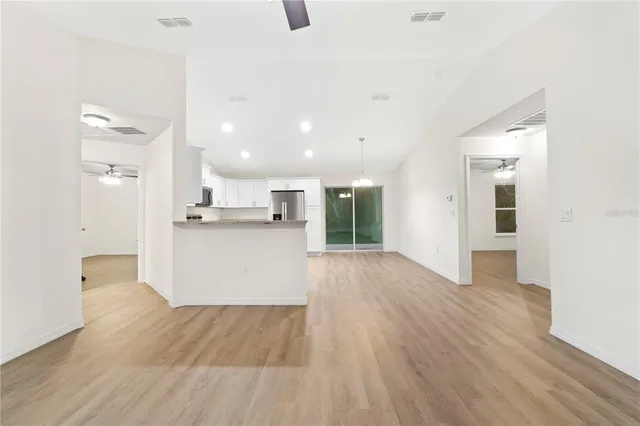 a view of kitchen with wooden floor