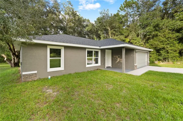 a backyard of a house with green space