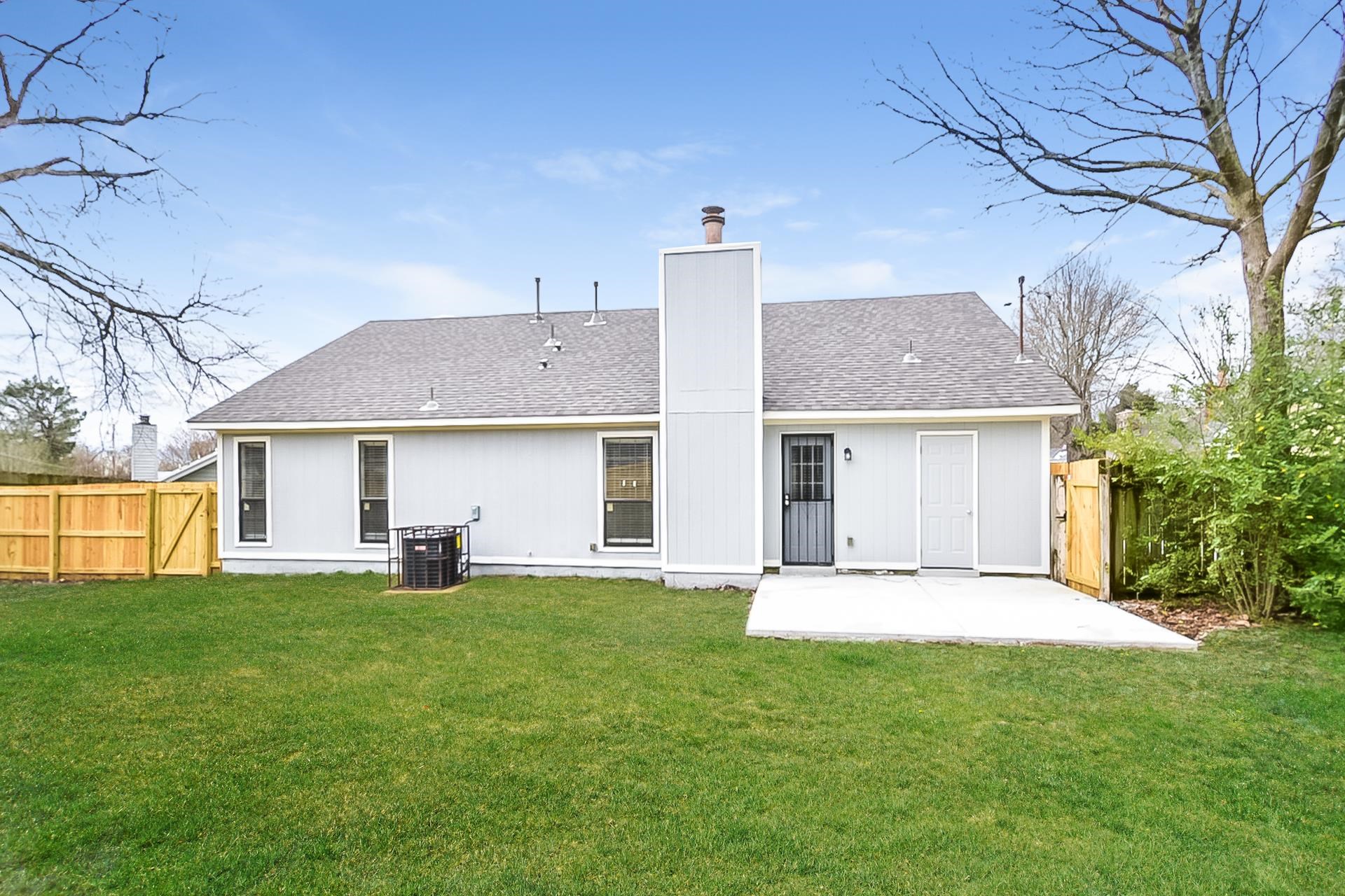 3890 Birchshade Cove Memphis, TN 38115 - Photo 15 of 16 a front view of a house with a yard and sitting area