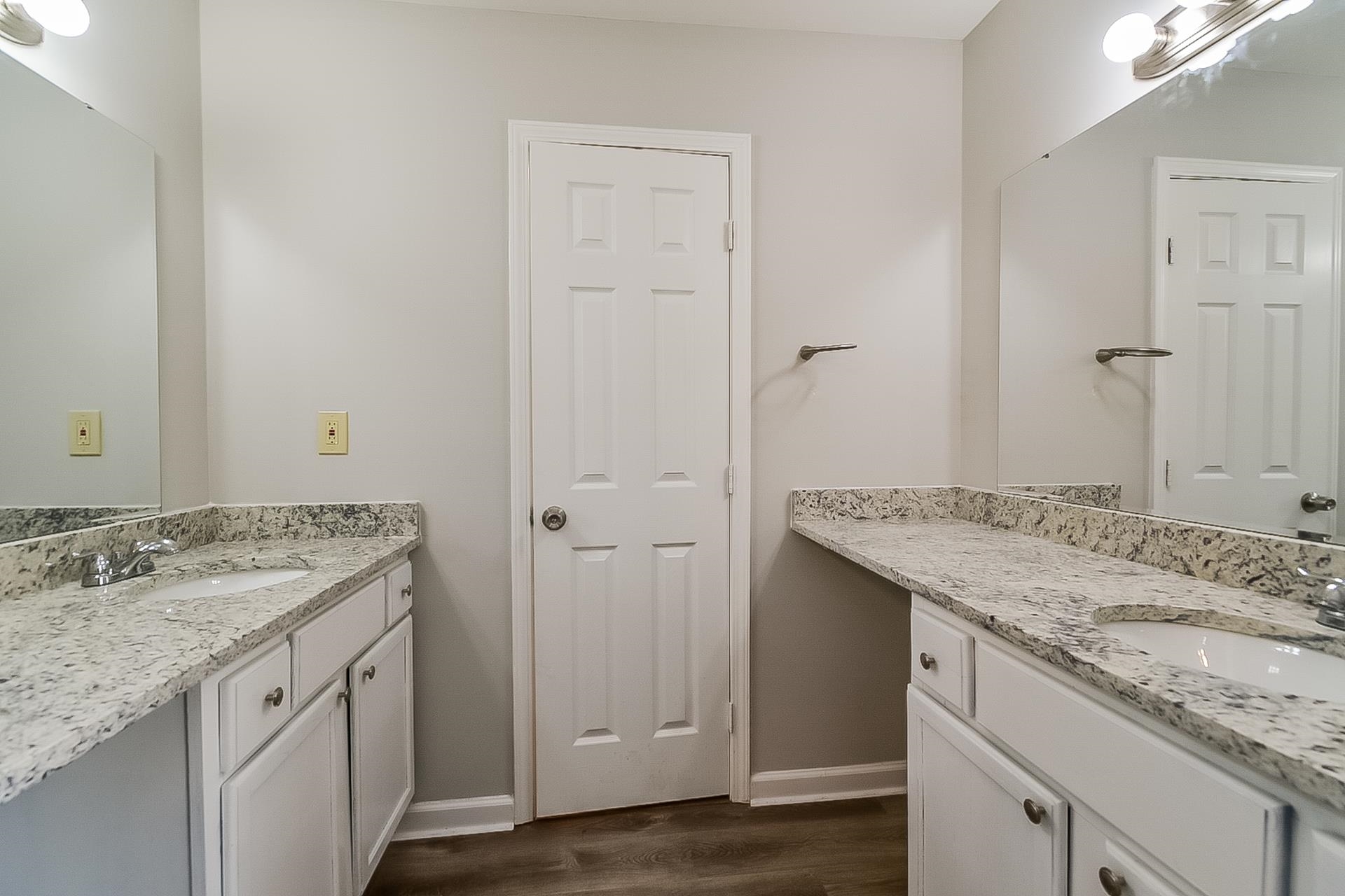 3890 Birchshade Cove Memphis, TN 38115 - Photo 10 of 16 a bathroom with a granite countertop sink and a mirror