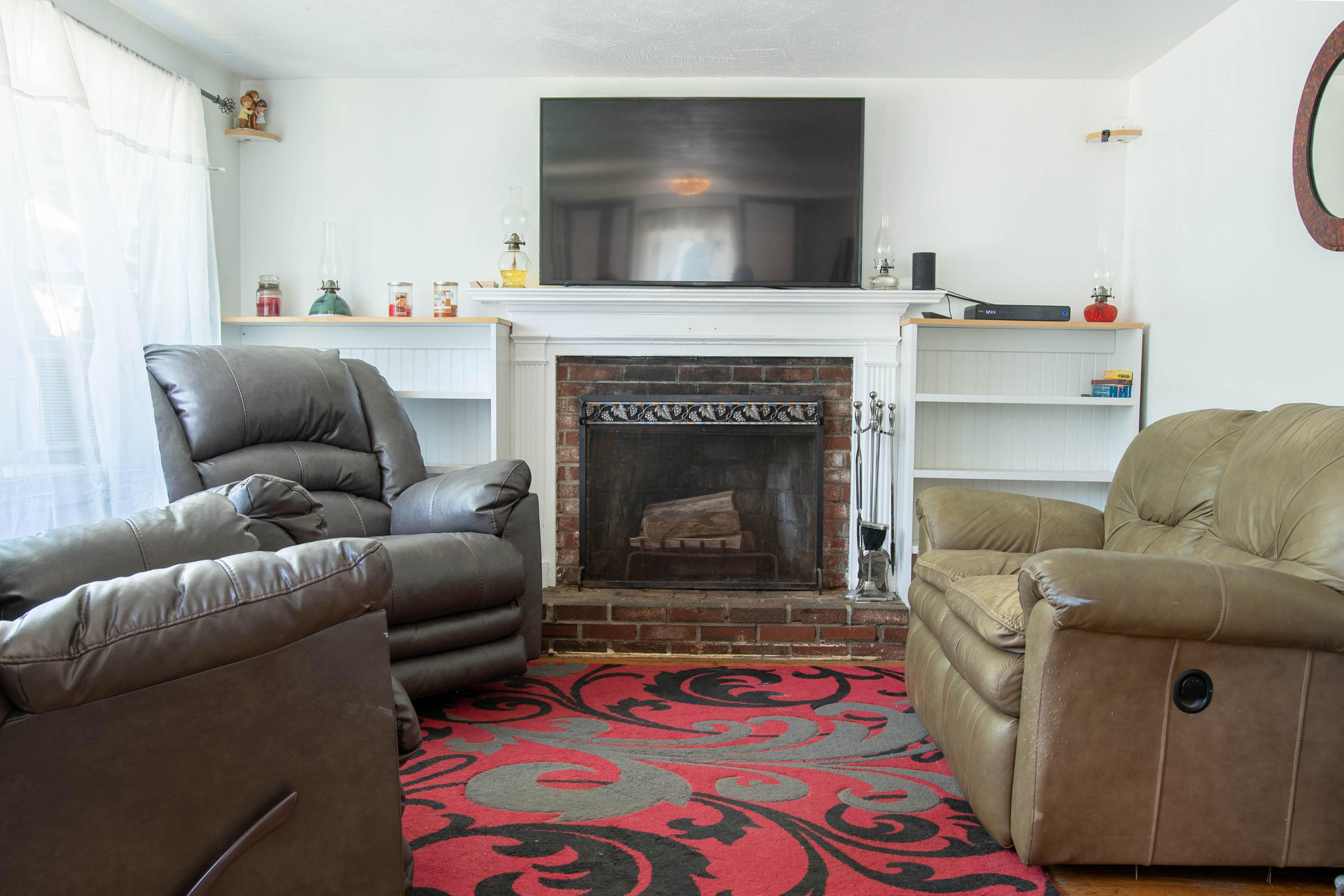 176 Hinckley Road Hyannis, MA 02601 - Photo 6 of 13 a living room with furniture and a fireplace
