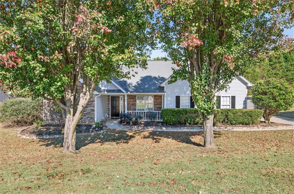 70 Tysor Court Jefferson, GA 30549 - Photo 4 of 50 a front view of a house with yard tree and outdoor seating