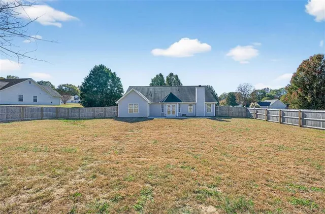 a view of a backyard of the house