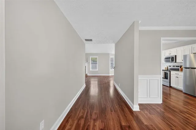 a view of a kitchen with wooden floor