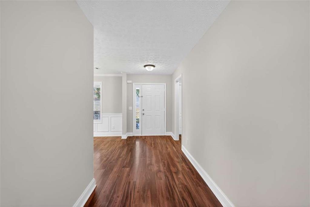 70 Tysor Court Jefferson, GA 30549 - Photo 7 of 50 a view of a hallway with wooden floor
