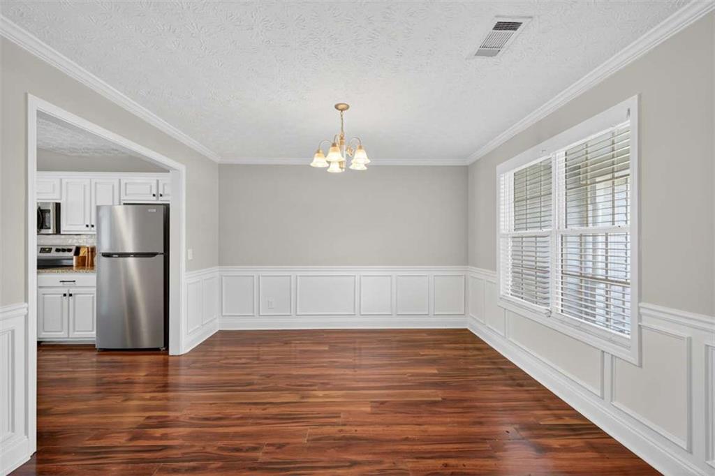 70 Tysor Court Jefferson, GA 30549 - Photo 8 of 50 a view of a room with wooden floor fireplace and windows