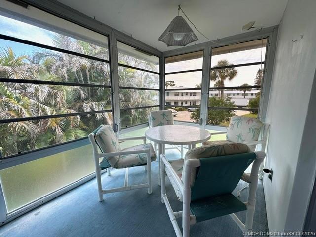 2929 Southeast Ocean Boulevard, Unit 1306 Stuart, FL 34996 - Photo 12 of 17 a view of a dining room with furniture window and outside view
