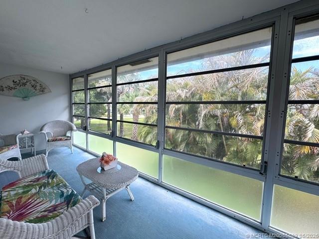 2929 Southeast Ocean Boulevard, Unit 1306 Stuart, FL 34996 - Photo 13 of 17 a room with furniture and a large window