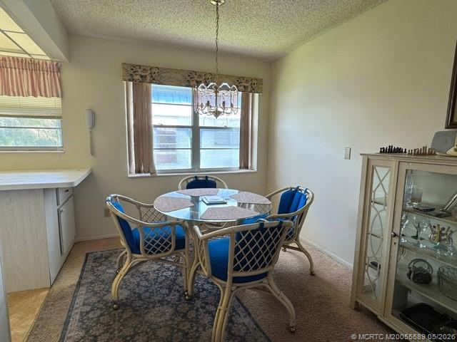 2929 Southeast Ocean Boulevard, Unit 1306 Stuart, FL 34996 - Photo 3 of 17 a view of a dining room with furniture window and outside view