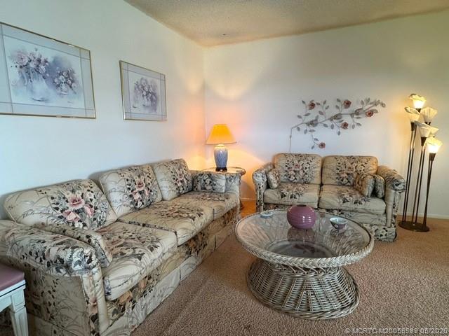 2929 Southeast Ocean Boulevard, Unit 1306 Stuart, FL 34996 - Photo 4 of 17 a living room with furniture and a white couch
