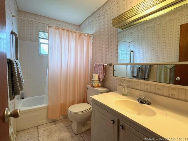 2929 Southeast Ocean Boulevard, Unit 1306 Stuart, FL 34996 - Photo 6 of 17 a bathroom with a sink a toilet and bathtub
