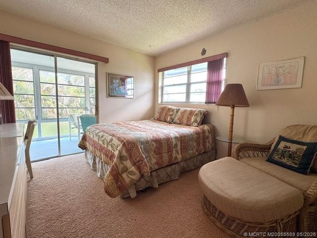 2929 Southeast Ocean Boulevard, Unit 1306 Stuart, FL 34996 - Photo 7 of 17 a bedroom with a bed and a lamp